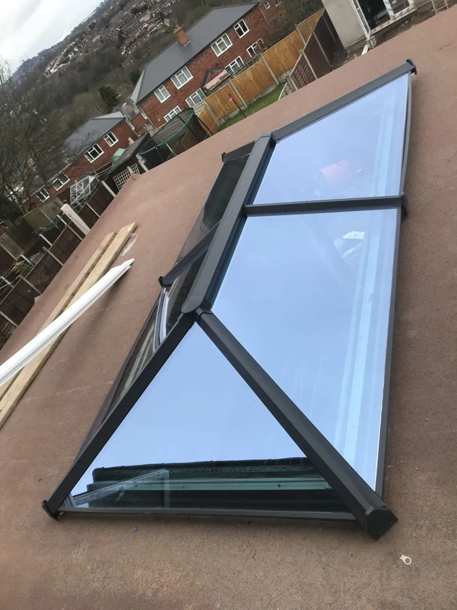 Fully assembled aluminium roof lantern delivered to site, laid on the roof deck ready to be lifted onto the upstand